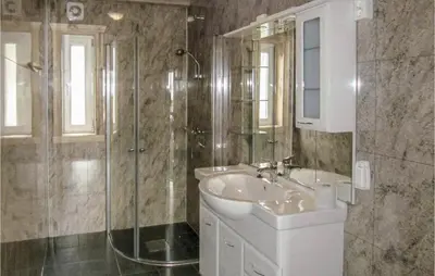 a bathroom with a sink and a shower at Holiday Home Bjoa Haugsgjerdet in Utbjoa