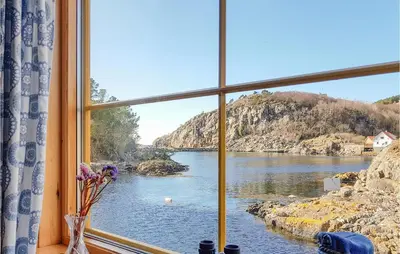 a window with a view of a body of water at Holiday Home Finnås Lyklingsjøvegen in Vinnes