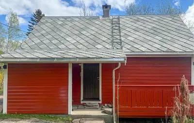 a red house with a gray roof at Holiday Home Ålvik Ytre Ålvik in Ålvik