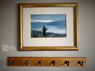 a framed picture of a man standing on a mountain at Great apartment in Trysil, ski inout, wifi, sauna in Trysil