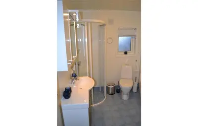 a bathroom with a shower and a sink and a toilet at Cozy Apartment In Norheimsund With Wifi in Norheimsund