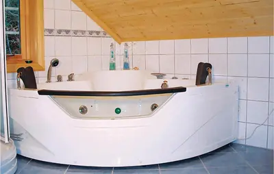 a bath tub in a bathroom with at Beautiful Home In Hatlestrand in Hatlestrand