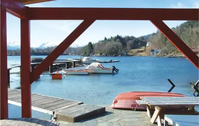 a view of a lake with boats in the water at Lovely Home In Hatlestrand With Kitchen in Hatlestrand