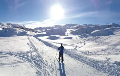 a person is skiing down a snow covered slope at Petterbua in Norheimsund