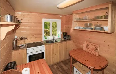 a kitchen with a sink and a stove at 2 Bedroom Beautiful Home In Balestrand in Balestrand