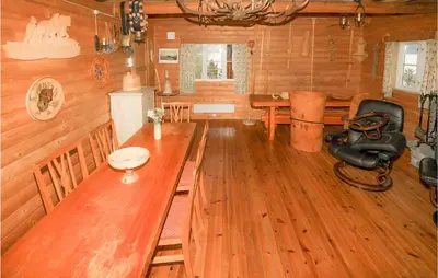 a wooden room with a long table and a desk at 2 Bedroom Beautiful Home In Balestrand in Balestrand