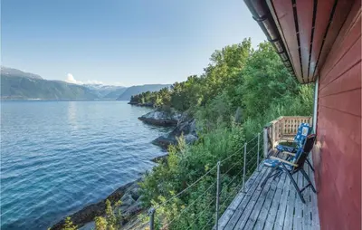 a balcony of a house with a view of a lake at Holiday Home Balestrand Stokkebø Ii in Balestrand