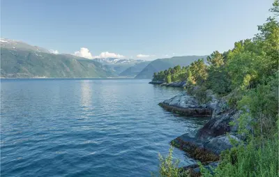 a view of a lake with mountains in the background at Holiday Home Balestrand Stokkebø Ii in Balestrand