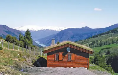 a small house with a grass roof on a hill at Stunning Home In Vik I Sogn With Wifi in Espeset