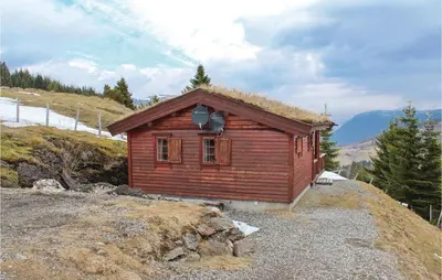 a small cabin on top of a mountain at Stunning Home In Vik I Sogn With Wifi in Espeset