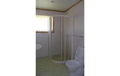 a bathroom with a toilet and a shower at Holiday Home Balestrand Stokkabø in Balestrand