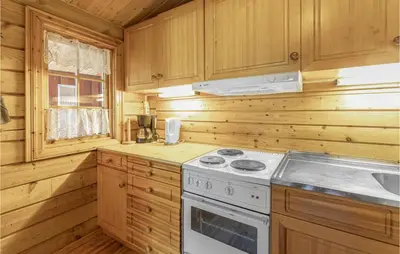 a kitchen with a stove and a sink at Beautiful Home In Olden With Sauna in Olden