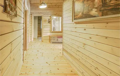 a hallway in a log cabin with wood paneling at Beautiful Home In Olden With Sauna in Olden
