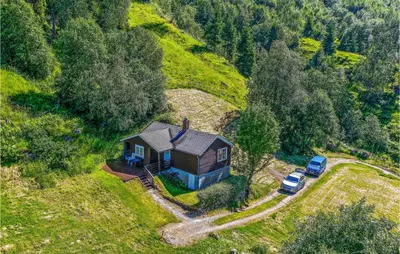 an aerial view of a small house on a hill at Holiday Home Olden Gjerde in Olden