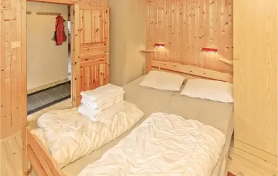 a room with two beds in a room with at Glomnes Nr 2 in Hjelle