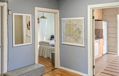 a room with a map on the wall and a kitchen at Amazing Home In Olden With Wifi in Olden