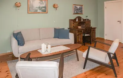a living room with a couch and a table at Amazing Home In Olden With Wifi in Olden