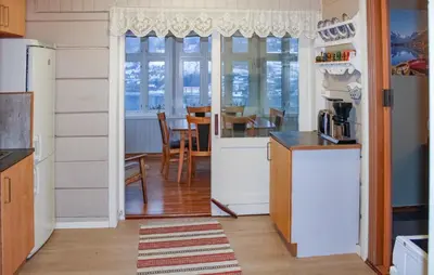 a kitchen with a door leading to a dining room at Amazing Home In Olden With Wifi in Olden