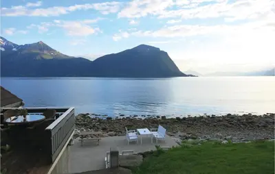 a view of a body of water with a mountain at Beautiful Home In Hundeidvik in Hundeidvik