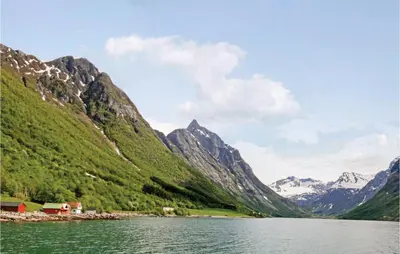 a view of a mountain range with a body of water at Gorgeous Home In Hundeidvik in Hundeidvik