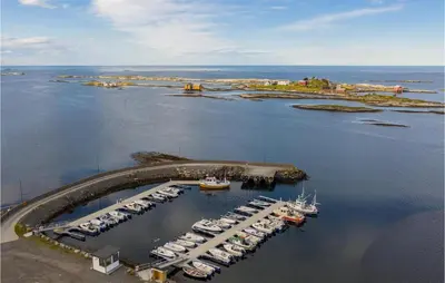 an aerial view of a marina with boats in the water at Holiday Home Farstad Rævhaugen in Farstad