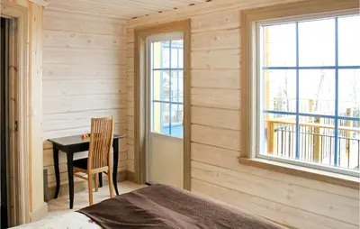 a bedroom with a desk and a table with a chair at Amazing Home In Trysil With Sauna in Trysil