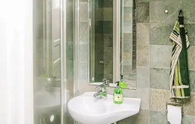 a bathroom with a sink and a shower at Amazing Home In Trysil With Sauna in Trysil
