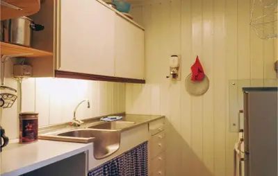 a small kitchen with a sink and a counter at Amazing Home In Ringebu in Ringebu