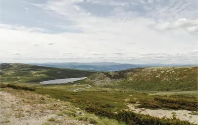 a view from the top of a hill with a river at Storhytta in Vinstra
