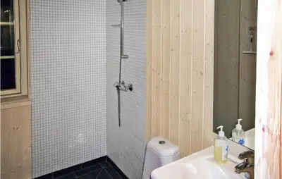 a bathroom with a shower and a toilet and a sink at Holiday Home Gålå Peer Gyntlia in Gålå