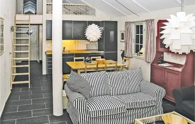 a living room with a couch and a table at Holiday Home Gålå Peer Gyntlia in Gålå