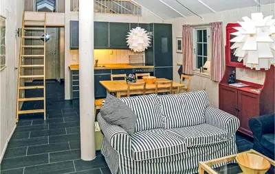 a living room with a couch and a table at Holiday Home Gålå Peer Gyntlia Iv in Gålå