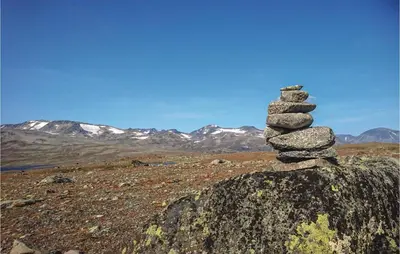 a stack of rocks sitting on top of a rock at Thorleifsbuskogheim in Vang I Valdres