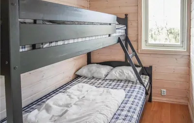 a bunk bed in a tiny house at Amazing Home In Hol With Sauna in Hol