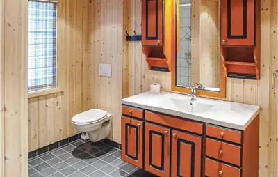 a bathroom with a sink and a toilet at Skarsnuten in Hemsedal