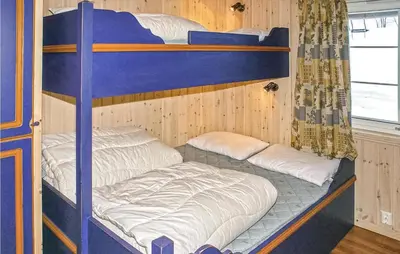 a couple of bunk beds in a room at Skarsnuten in Hemsedal