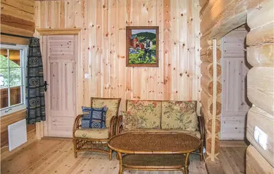 a living room with a couch and a table at Skarsnuten in Hemsedal