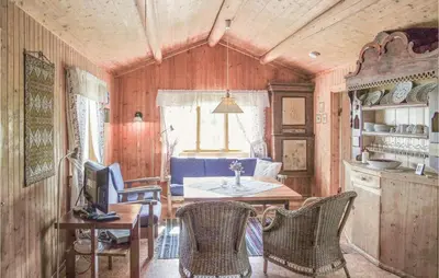 a room with a table and chairs and a kitchen at Beautiful Home In Hemsedal With Kitchen in Hemsedal