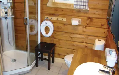 a bathroom with a shower and a toilet and a sink at Holiday Home Flå Øvre Reinsjøfjell in Flå