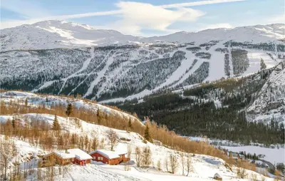 a ski lodge on a mountain in the snow at Beitebu in Hemsedal