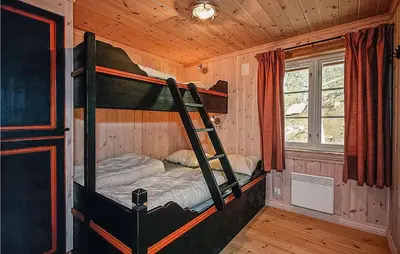a bedroom with two bunk beds in a cabin at Nice Home In Hemsedal With Sauna in Hemsedal