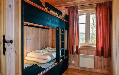 a bedroom with a bunk bed in a room with a window at Nice Home In Hemsedal With Sauna in Hemsedal