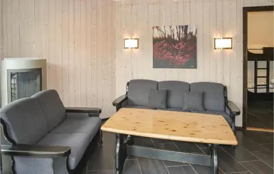 a waiting room with a couch and a table at Gorgeous Apartment In Hemsedal in Hemsedal