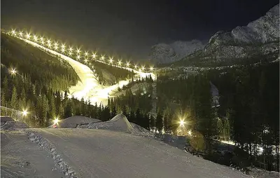 a snowy slope with lights on a mountain at night at Gorgeous Apartment In Hemsedal in Hemsedal