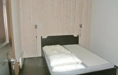 a bed with white sheets and pillows in a room at Gorgeous Apartment In Hemsedal in Hemsedal