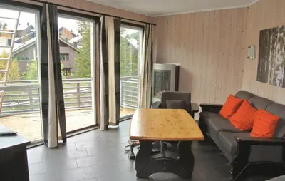 a living room with a couch and a table at Nice Apartment In Hemsedal With Sauna in Hemsedal