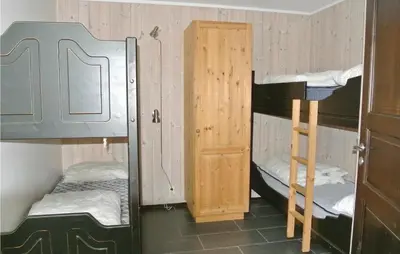 a room with two bunk beds and a ladder at Nice Apartment In Hemsedal With Sauna in Hemsedal