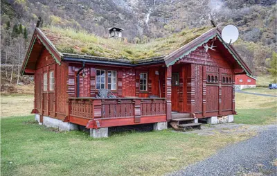 a log cabin with a grass roof on top of it at Awesome Home In Rauland With Kitchen in Rauland