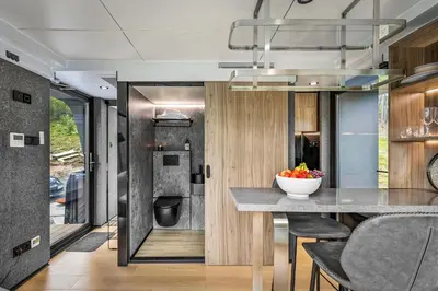 a kitchen and dining room with a table and chairs at Sogndal Fjordpanorama - The atmosphere in Sogndal