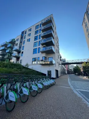 a row of bikes parked in front of a building at Modern Apartment - Amazing Terrace and Fjord View, Close to City Center in Bergen